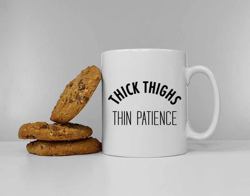 Thick Thighs Thin Patience Funny Slogan Mug Graphic Tee – Soft Feel · Trending Graphic Apparel