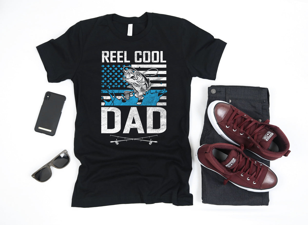Reel Cool Dad Fisherman Fathers Day American Flag USA TShirt Tank Top Hoodie Sweatshirt Long Sleeve Apparel Gift Hoodie – Premium Graphic · Great Gift For Fans