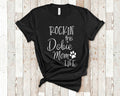 Rockin This Life Dobie Mom Tshirt Dog Owner Gifts Funny Dobie Shirt Gifts for Dobie Lovers Graphic Tee – Feel-Good Design · High-Quality Print