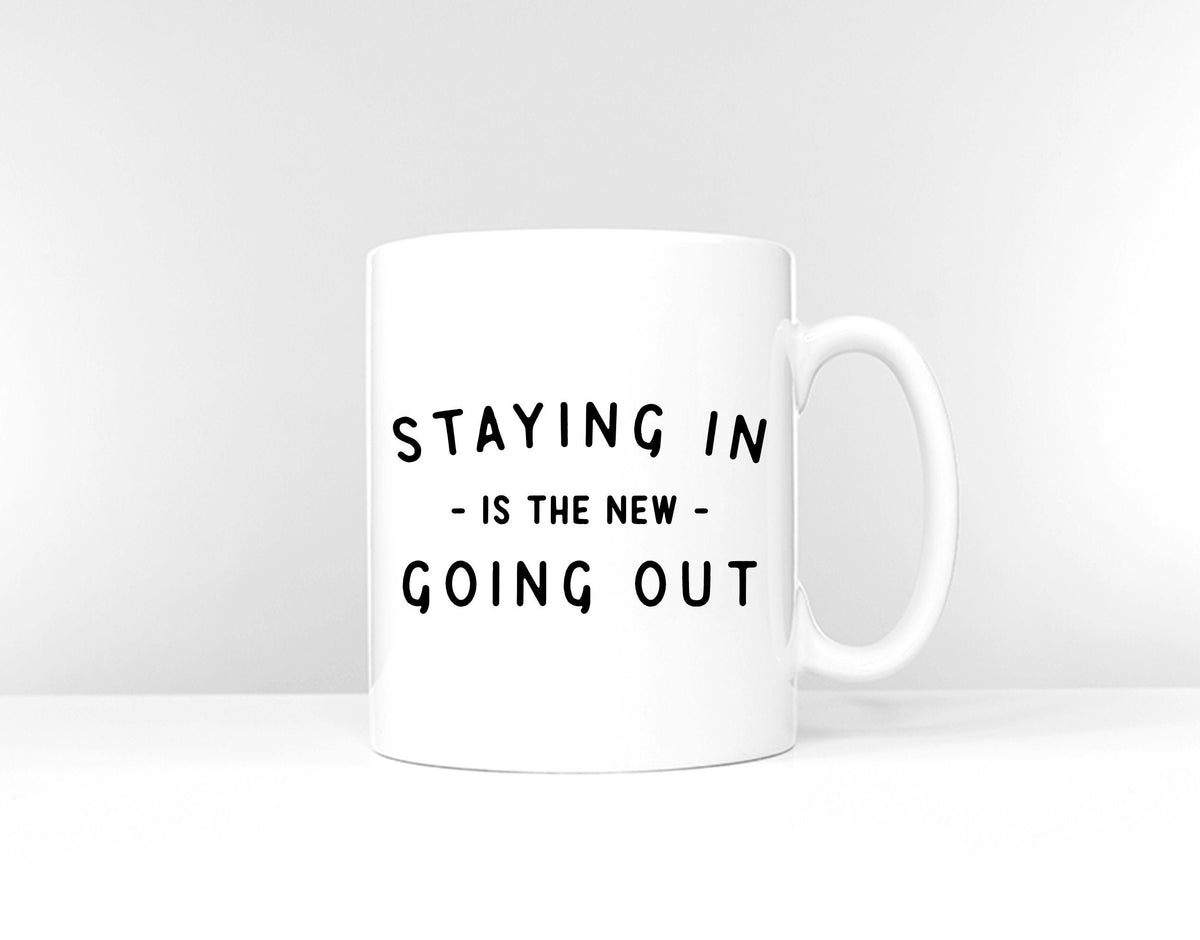 Staying In Is The New Going Out Mug Home Office Coffee Mug Graphic Tee – Fan Favorite · Great Gift For Fans