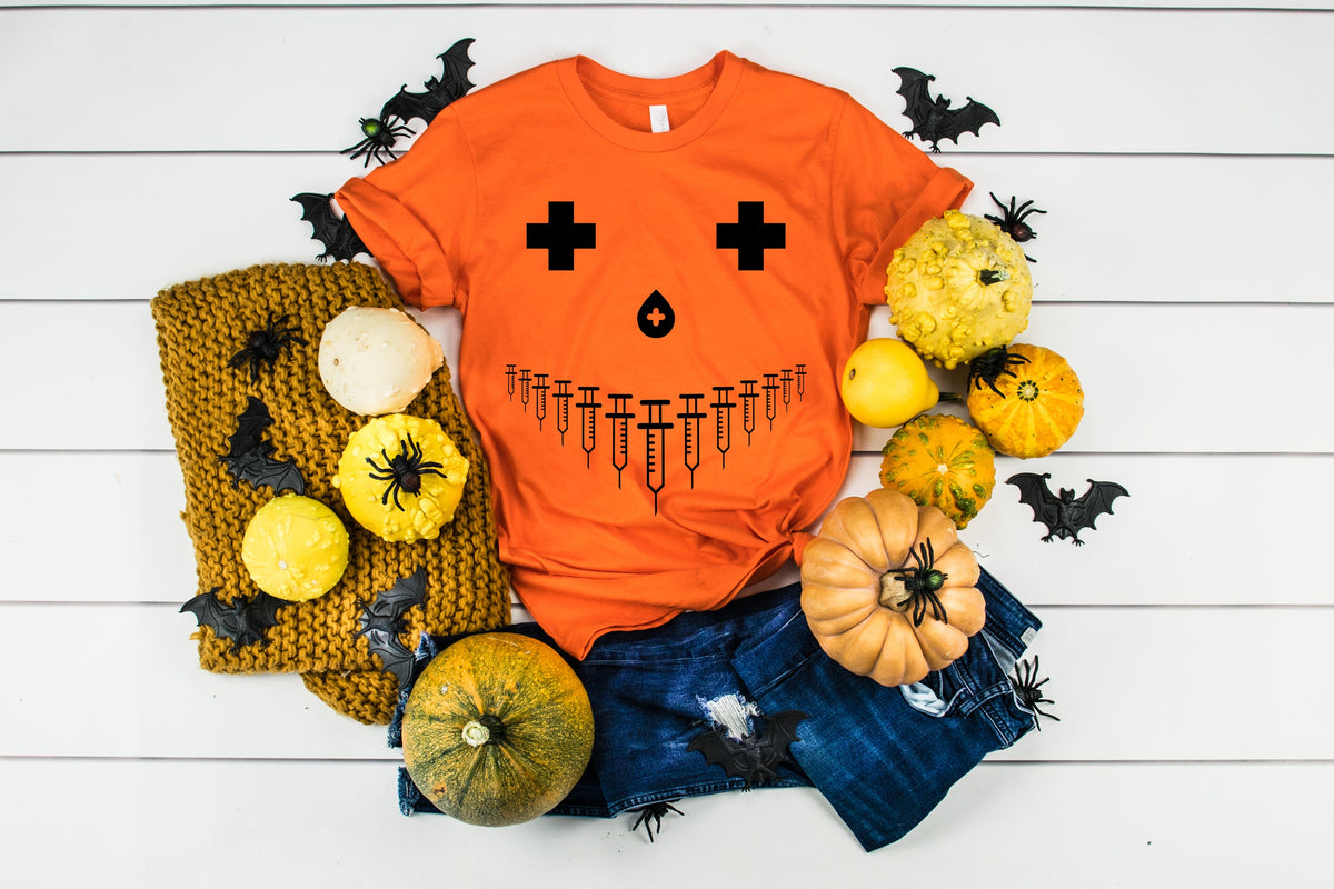 Funny Pumpkin Nurse Costume Halloween Shirt Nursing Student Syringe Pumpkin Face TShirt Graphic Tee – Premium Graphic · High-Quality Print
