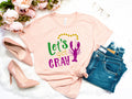 Mardi Gras ShirtLets get gray Shirt Fat Tuesday ShirtFlower de luce ShirtLouisiana ShirtNew Orleans ShirtWomens Mardi Gras Shirt Graphic Tee – Fan Favorite · Top Pick For Any Outfit