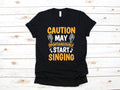 Caution May Start Singing TShirt Funny Singer Karaoke Tee Tank Top Hoodie Sweatshirt Long Sleeve Kids Tee Apparel Gift Hoodie – Premium Graphic · Trending Graphic Apparel