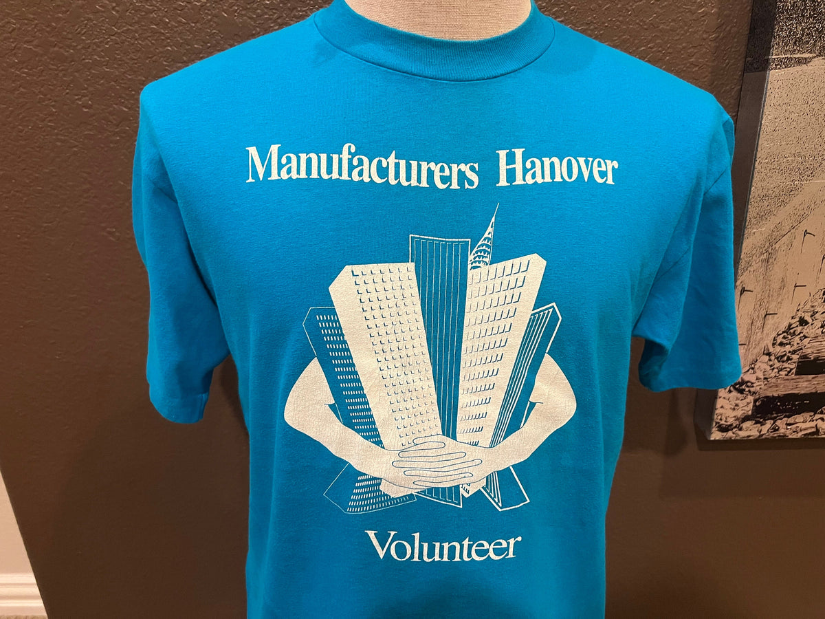 Vintage 8039s Manufacturers Hanover Volunteer Blue T Shirt Size L Graphic Tee – Bold Style · Trending Graphic Apparel