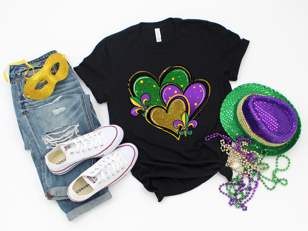 Mardi Gras Shirt For WomanMardi Gras Heart ShirtFat Tuesday ShirtLouisiana ShirtSaints New Orleans ShirtMardi Gras Day Shirt Graphic Tee – Soft Feel · Top Pick For Any Outfit