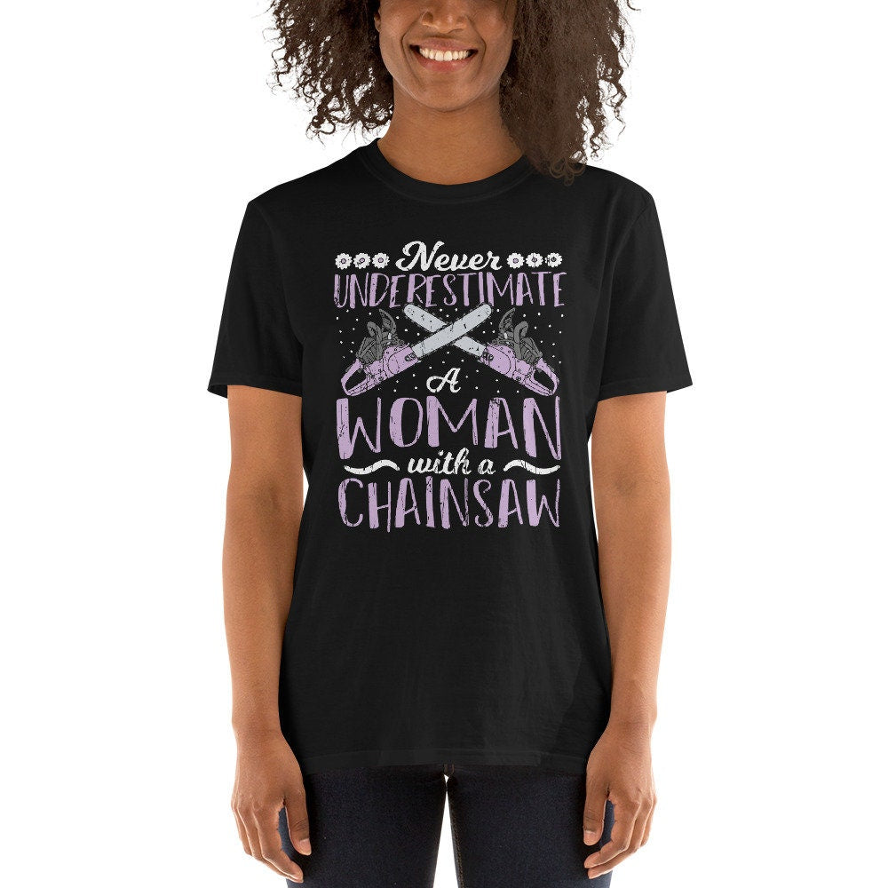 Never Underestimater a Woman With Chainsaw T Shirt Graphic Tee – Cozy Vibes · Trending Graphic Apparel