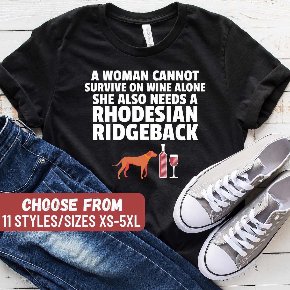 Funny Rhodesian Ridgeback Shirt Ridgeback Lover Gift A Woman Cannot Survive On Wine Alone She Also Needs A Rhodesian Ridgeback TShirt Graphic Tee – Everyday Comfort · Perfect For Daily Wear