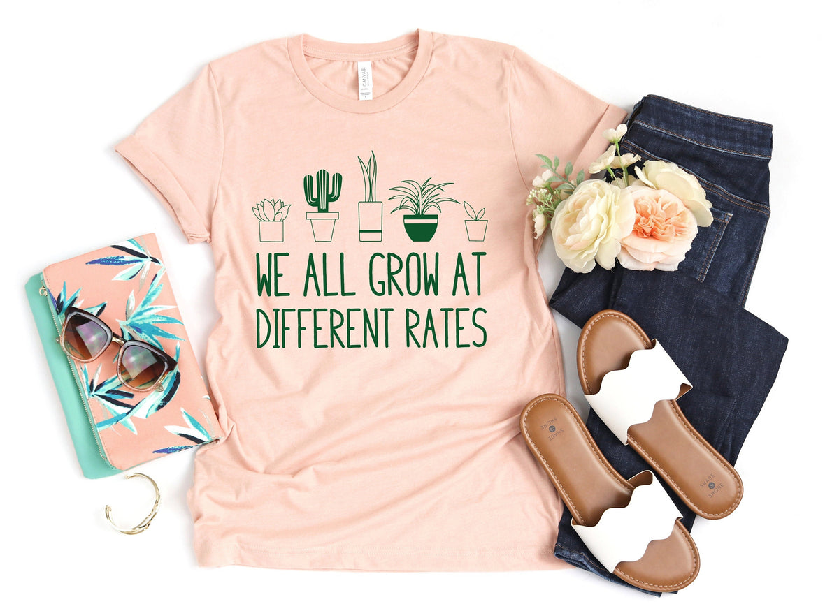 We All Grow At Different Rates Kindergarten Shirt Elementary Shirt Teacher Shirts Funny Teacher Shirt Gift for Teacher Teacher Life Graphic Tee – Everyday Comfort · Trending Graphic Apparel