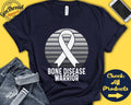 Bone Diseases Shirt Bone Diseases Awareness White Ribbon Warrior Fighter Surgery Recovery Tank Hoodie A1500 Hoodie – Feel-Good Design · Trending Graphic Apparel