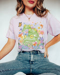 Nostalgic Frog Tee Shirt with Whimsical Aesthetic Funny Frog Lover Shirt with Flowers Cute and Weird Frog Tee for Animal Lover or Zoo Trip Graphic Tee – Premium Graphic · Perfect For Daily Wear