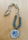 Porcelain Blue Crab Pendant Necklace with recycled Ghana Glass Bone Beads and Silver Accents Graphic Tee – Fan Favorite · Must-Have Style