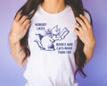 Silly Bookish Tee Shirt for Cat Mom Who Loves Books Nobody Likes Books and Cats More Than I Do Funny Bookworm T for Reader Who Loves Cats Graphic Tee – Soft Feel · High-Quality Print