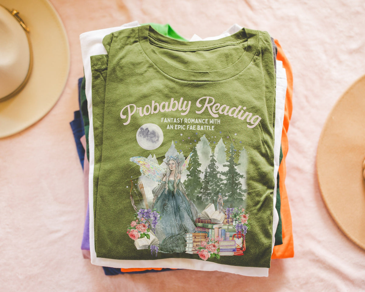 Book Lover Gift Idea for Romantasy Reader Probably Reading Fantasy Romance With An Epic Fae Battle Fantasy Adventure Bookworm Tee Shirt Graphic Tee – Soft Feel · Trending Graphic Apparel