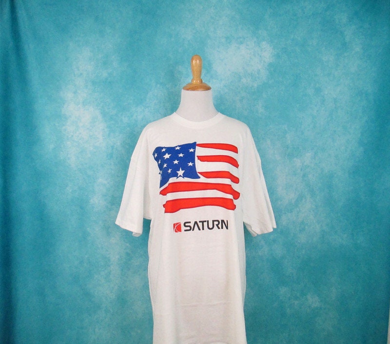 Vintage 9039s Saturn Motors NWT American Flag Shirt Single Stitch XL Saturn Car Company Spellout Logo Promo Tee Graphic Tee – Feel-Good Design · Great Gift For Fans