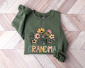 Grandma Sweatshirt With NamesGrandma Wildflowers ShirtGrandkids Names SweaterGrandma CrewneckMother39s Day Grandma Gift Sweatshirt – Aesthetic Look · Great Gift For Fans
