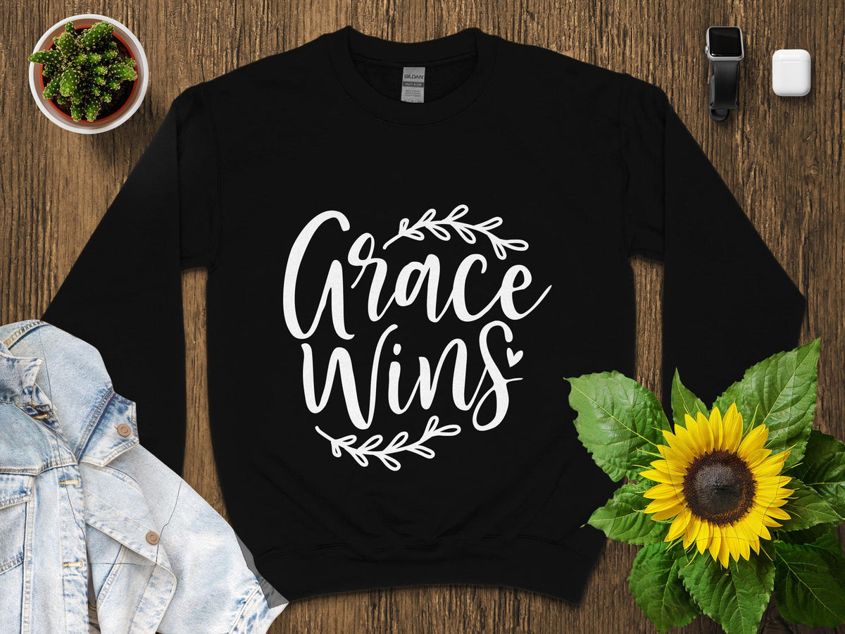 Inspirational Grace Wins Quote T Shirt Elegant Calligraphy with Wreath Positive Message Tee Casual Style Unisex Clothing Graphic Tee – Bold Style · High-Quality Print