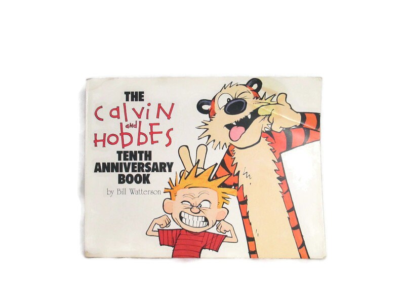 Calvin and Hobbes Tenth Anniversary Book Distressed Vintage 1995 Copyright Comic Strip Collection Paperback Book by Bill Watterson Graphic Tee – Fan Favorite · Must-Have Style
