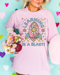 Cute Science Teacher Tee Shirt with Retro Flowers in Outer Space Learning is a Blast Trendy Back To School Elementary School Teacher Shirt Graphic Tee – Warm & Stylish · High-Quality Print