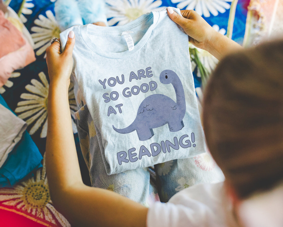 Cute Reading Teacher TShirt for First Grade Teacher Who Loves Dinosaurs You Are So Good at Reading Dinosaur Lover Tee School Librarian Graphic Tee – Fan Favorite · Trending Graphic Apparel