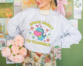 Cute Dinosaur Lover Sweatshirt for Elementary School Teacher Speak Kindly To Yourself Adorable Y2K Aesthetic Crewneck for Science Teacher Sweatshirt – Aesthetic Look · High-Quality Print
