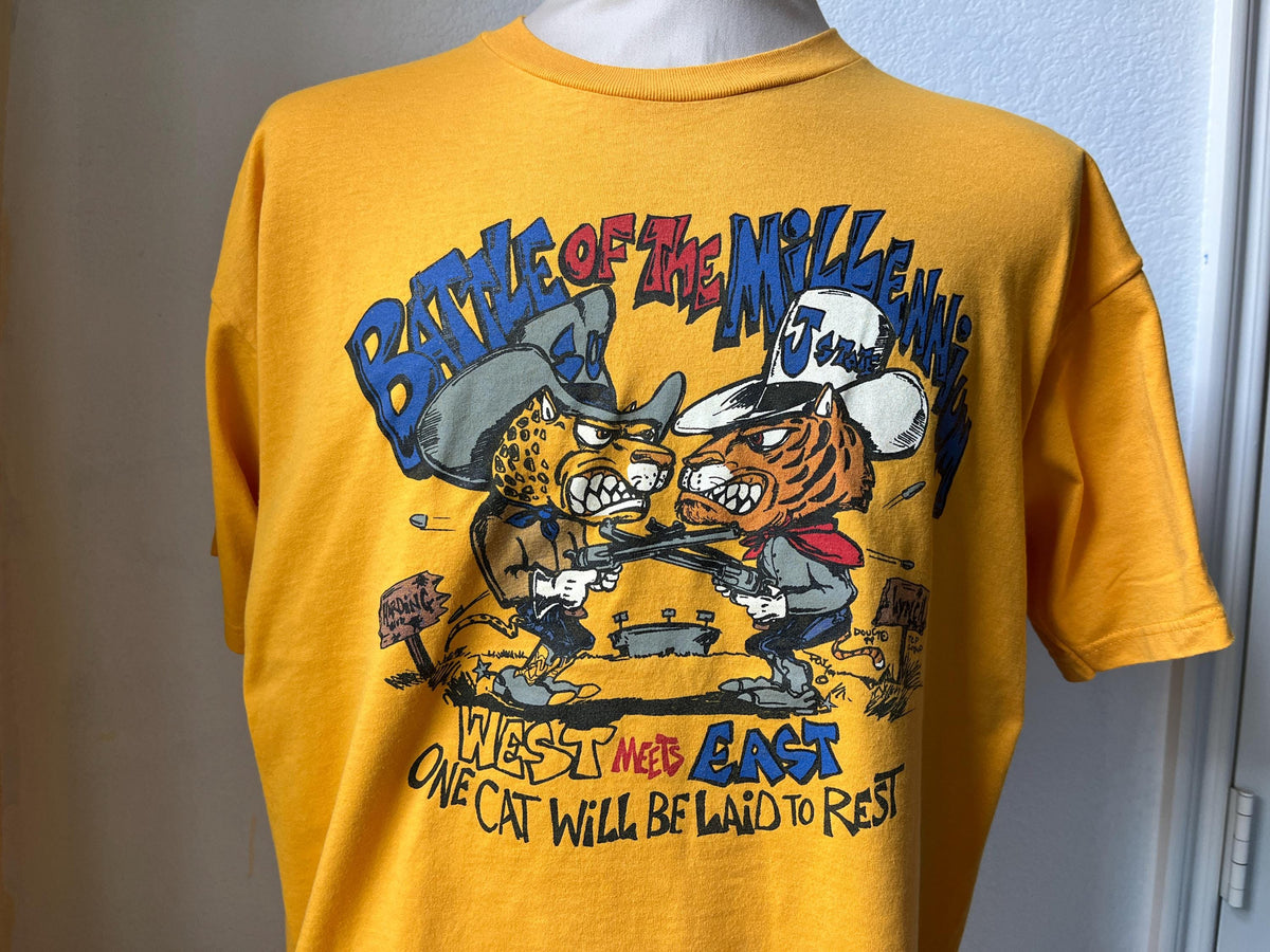Vintage 1999 Battle Of The Millennium West Meets East Football Yellow TShirt Size XL Graphic Tee – Premium Graphic · High-Quality Print