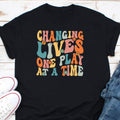 Changing Lives One Play At A Time Shirt Mental Therapy Shirt Mental Health Awareness Shirt Psychologist Shirt Therapy Counselor Shirt Graphic Tee – Aesthetic Look · Perfect For Daily Wear