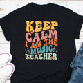 Keep Calm I Am The Music Teacher Shirt Music Lover Shirt Music Teacher Gift Music Teacher Appreciation Shirt Best Music Teacher Shirt Graphic Tee – Fan Favorite · Top Pick For Any Outfit