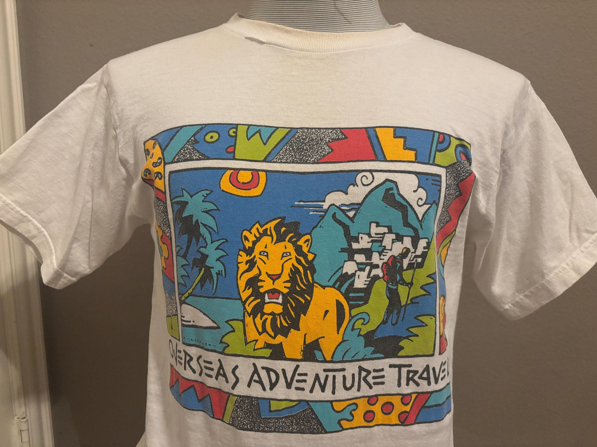 Vintage 9039s Overseas Adventure Travel Lion T shirt M Graphic Tee – Warm & Stylish · High-Quality Print