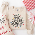 Be The Light Sweatshirt Religious Christmas Sweatshirt Christian Holiday Sweater Faith Based Gift Christmas Gifted Festive Apparel Sweatshirt – Warm & Stylish · Trending Graphic Apparel