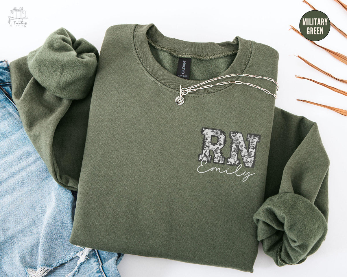Personalized RN SweatshirtToile De Jouy Custom Nurse SweatshirtFloral Registered Nurse CrewneckNurse Name GiftNurse Grad Gift Sweater Sweatshirt – Fan Favorite · Trending Graphic Apparel
