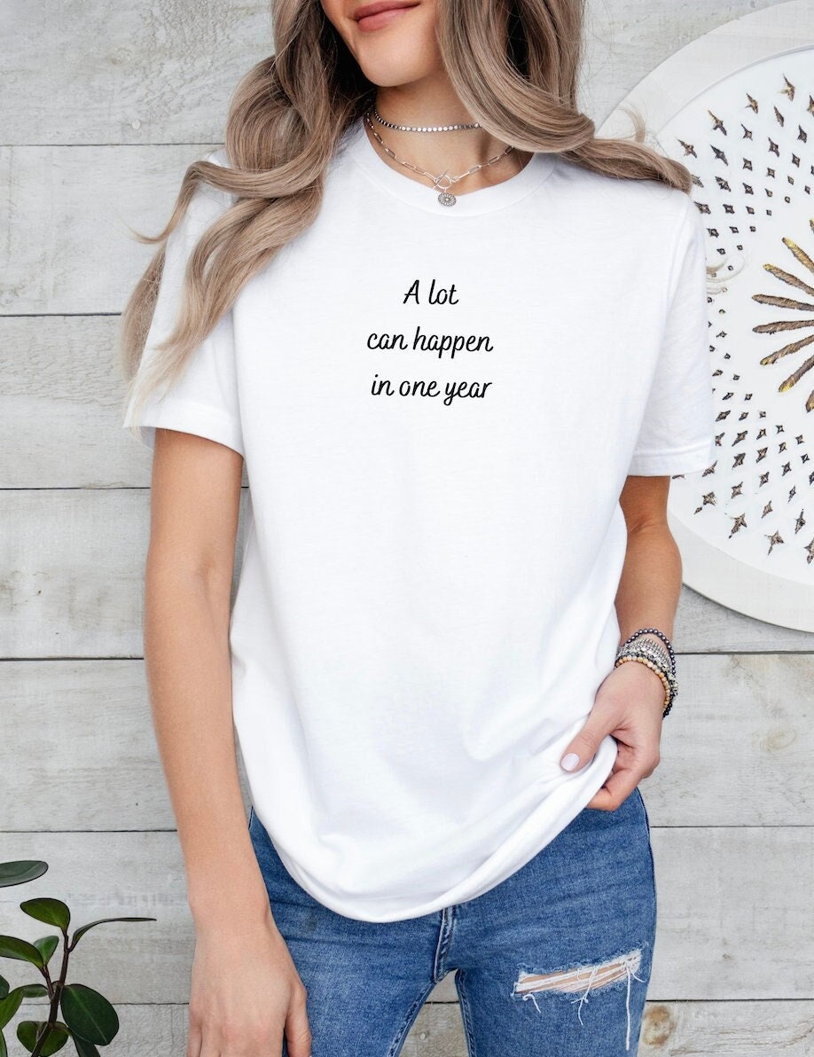 A lot Can Happen In One Year Say Yes to New Adventures Inspiring sayings front back tee Gift her Graphic Tee – Fan Favorite · High-Quality Print