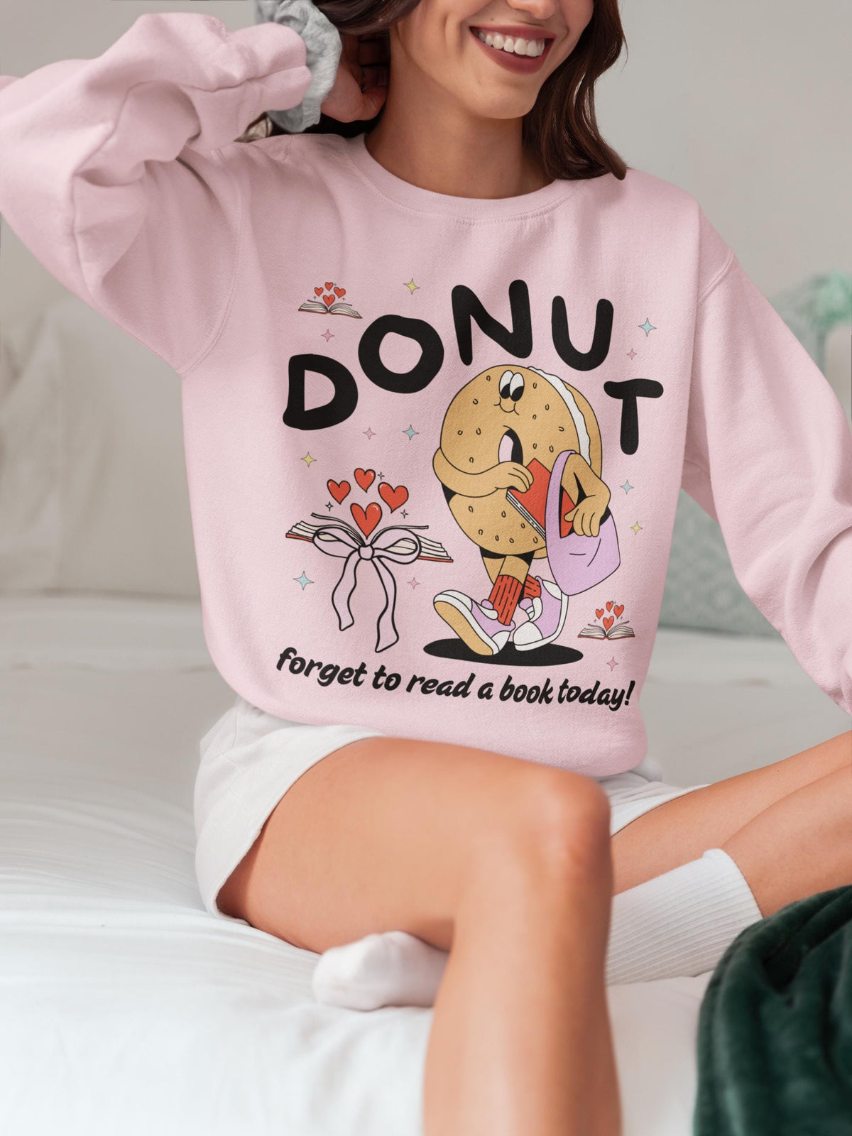 Reading Teacher Sweatshirt for Book Lover or Romance Reader Funny Saying Bookworm Donut Crewneck with Hearts Groovy School Librarian Gift Sweatshirt – Premium Graphic · Trending Graphic Apparel