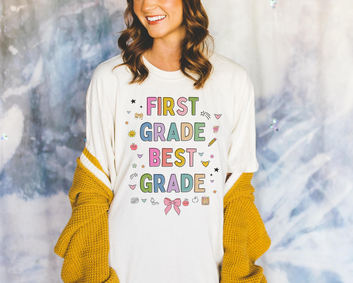 First Grade Teacher Tee Shirt with Cute 90s Aesthetic Doodles Colorful Matching Teacher TShirt for First Grade Crew New Teacher Present Graphic Tee – Feel-Good Design · Great Gift For Fans