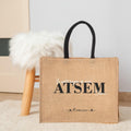 Sac en jute personnalis quotLe Petit Bazar de mon ATSEM Chriequot Cadeau atsem personnalis Sac atsem cadeau de fin d39anne atsem Graphic Tee – Warm & Stylish · High-Quality Print