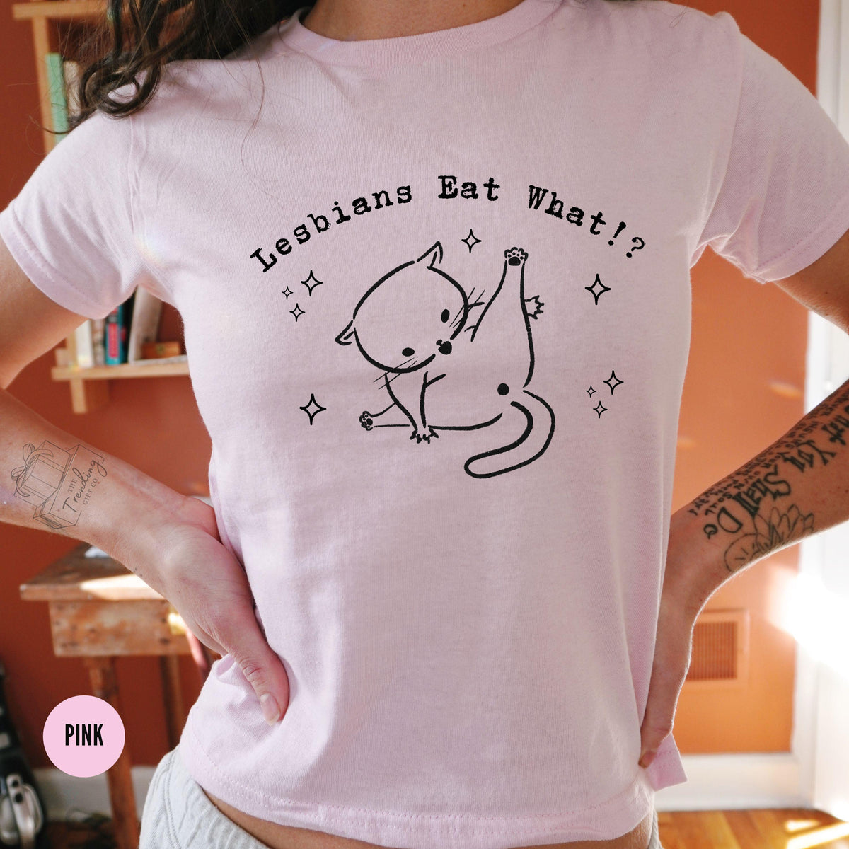 Lesbians Eat What Baby Tee Subtle Lesbian Sapphic Shirt WLW Gift Ideas Femme Pride Month Cat Tee Queer Fashion Bisexual BabyTee Graphic Tee – Fan Favorite · Must-Have Style