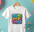 3rd Birthday Tshirt Young Wild And Three Third Birthday Shirt Colorful Rainbow Birthday Top Kids Birthday Shirt I am Three Tee 1149 Graphic Tee – Everyday Comfort · Great Gift For Fans