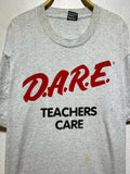 Vintage 90s DARE Teachers Care Anti Drug Slogan T Shirt Size 2XL Graphic Tee – Warm & Stylish · Trending Graphic Apparel