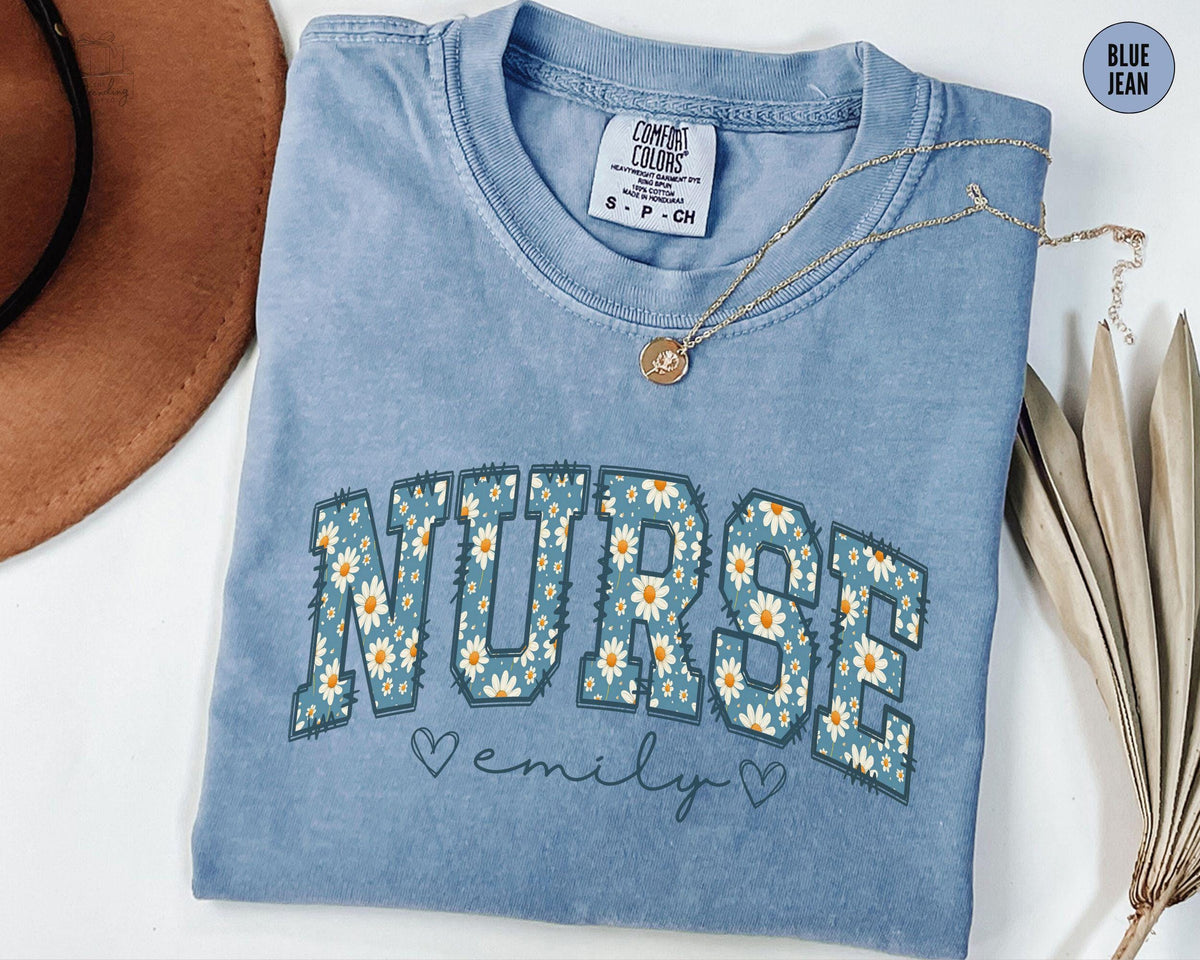 Personalized Nurse Shirt Custom Nurse Shirt Daisy Floral Nursing School Tee Nurse Tee Gift For Nurse ER Nurse Shirts Graphic Tee – Warm & Stylish · Top Pick For Any Outfit