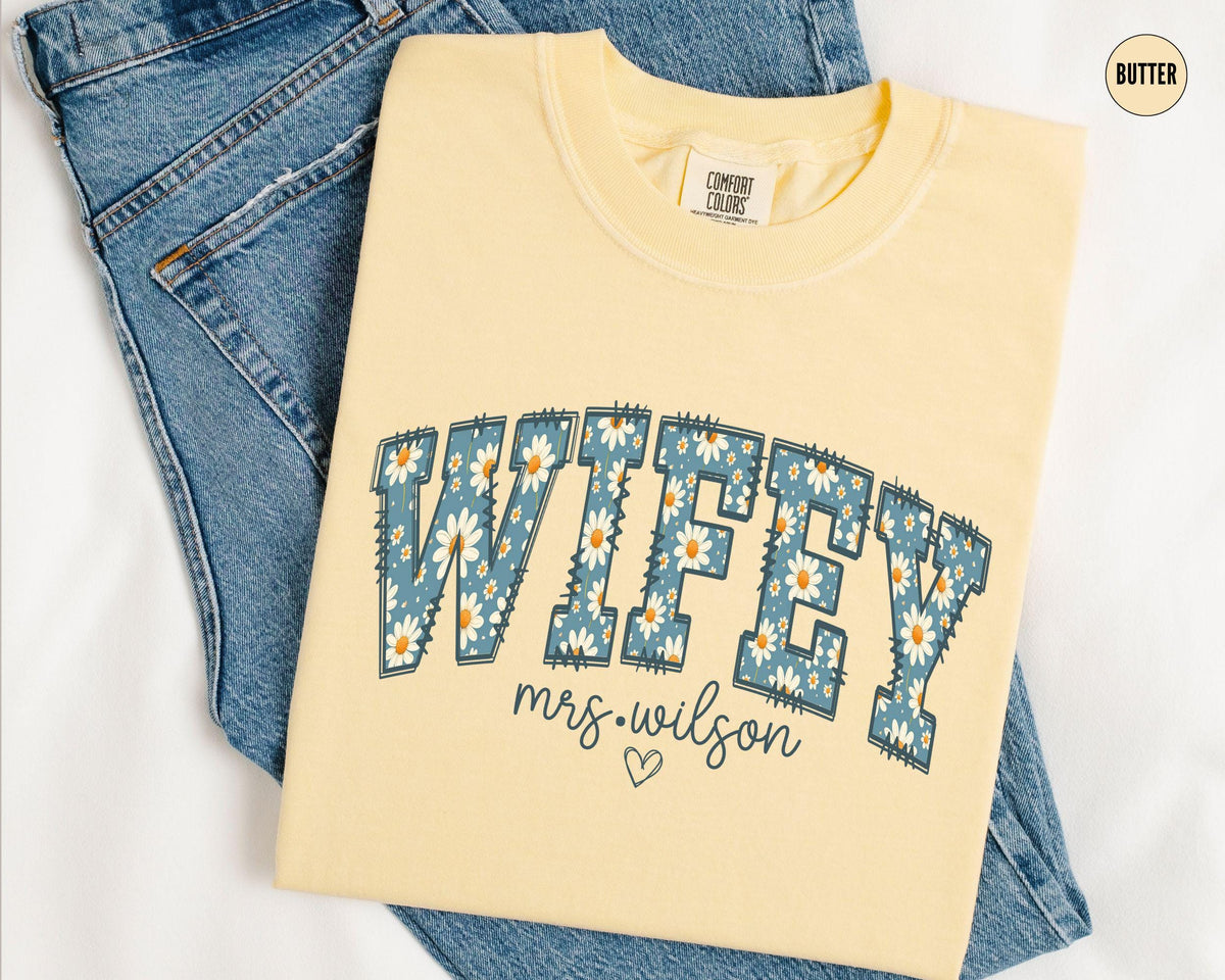 Personalized Wifey Shirt Daisy New Bride Shirt Custom Wifey TShirt Floral Honeymoon Tshirt Fiancee Tee Coquette Bridal Shower Gift Graphic Tee – Feel-Good Design · Top Pick For Any Outfit