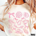 Coquette Seashell Shirt Trendy Girly Pink Bows Shirt Coastal Aesthetic Tee Ocean Lover Gift Beach Sea Shell Lover Gift Graphic Tee – Aesthetic Look · Perfect For Daily Wear