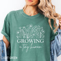Growing A Tiny Human Pregnant Mom Shirt Wildflowers Pregnancy Announcement Shirt Expecting Mom Gift Baby Reveal Shirt Graphic Tee – Premium Graphic · High-Quality Print