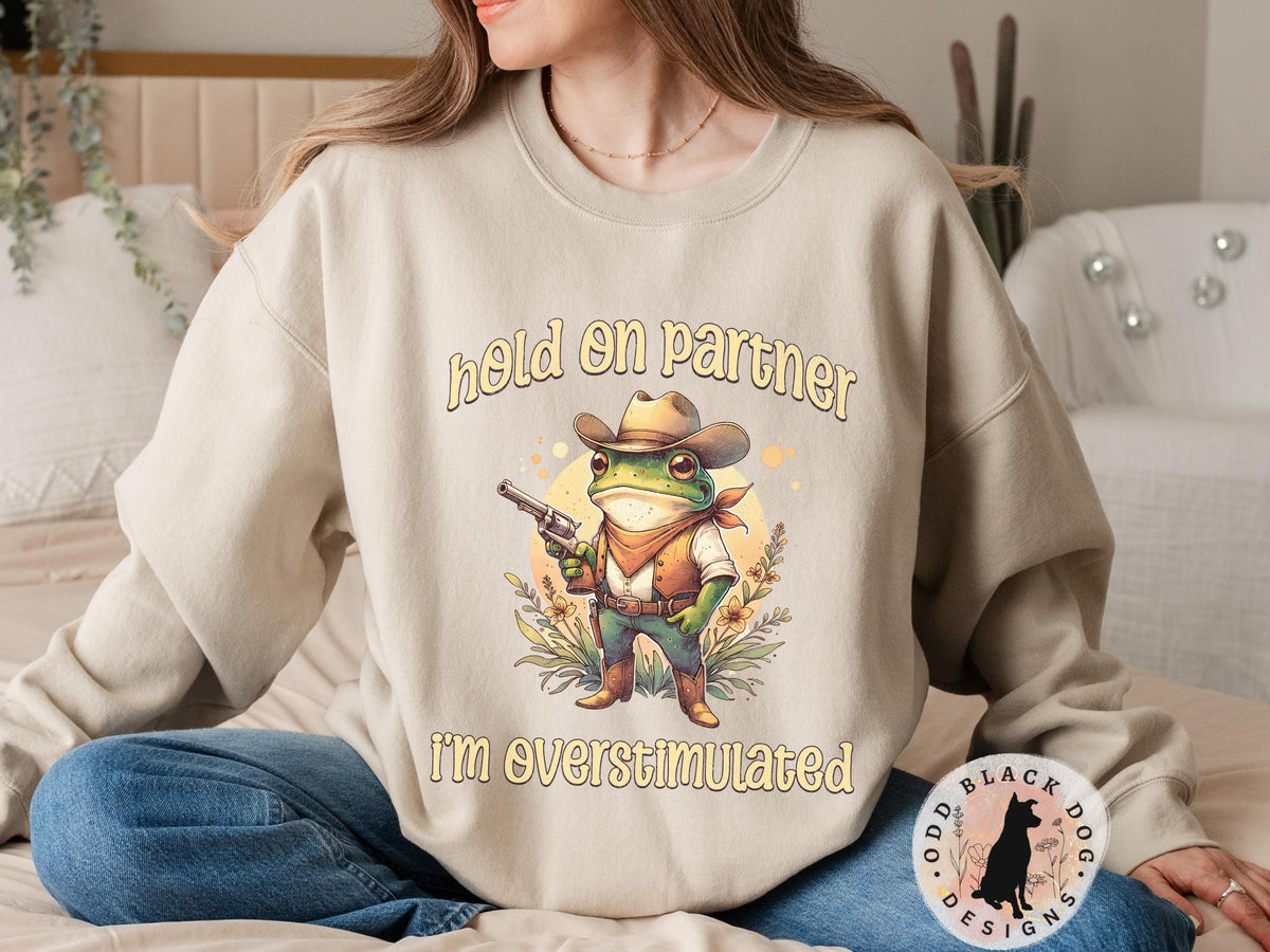 Hold On Partner I39m Overstimulated Sweatshirt Funny Cowboy Frog Unhinged Sweater Frog Shirt for ADHD Weirdcore Gen Z Funny Meme Sweatshirt Sweatshirt – Bold Style · Trending Graphic Apparel
