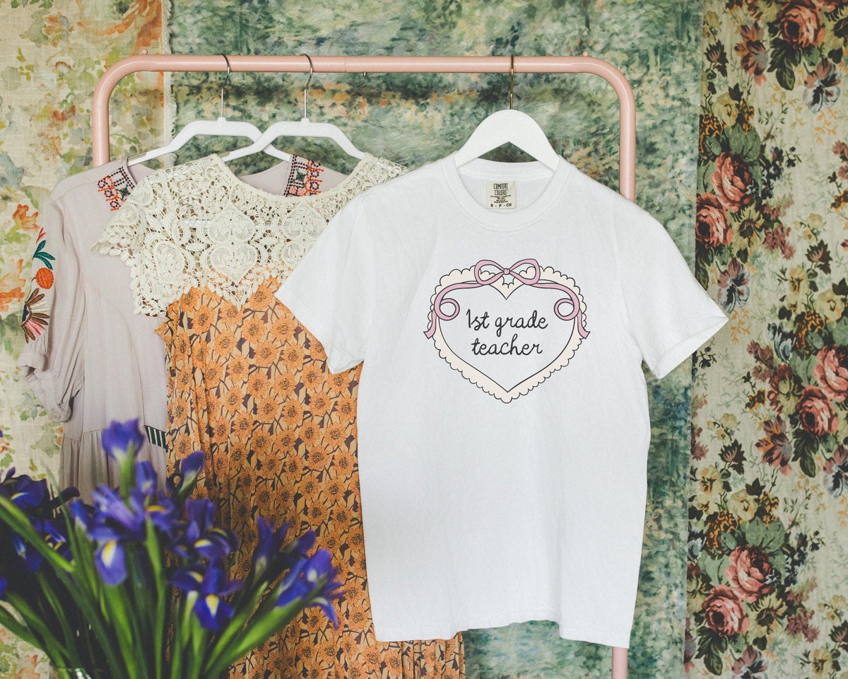 First Grade Teacher TShirt for First Grade Crew Cute Retro Aesthetic Heart Tee with Ribbon Matching Teacher Tee New Teaching Job Gift Graphic Tee – Feel-Good Design · Perfect For Daily Wear