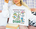 Read Banned Books Dinosaur Lover Sweatshirt for Scientist Who Loves Reading Funny Saying Bookish Shirt Book Lover Gift for Paleontologist Sweatshirt – Bold Style · Trending Graphic Apparel