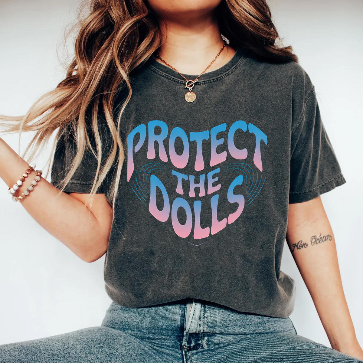 Protect The Dolls Feminist Empowerment Trans Rights Pride LGBTQ Support Retro Gradient Style Graphic Tee – Bold Style · Must-Have Style