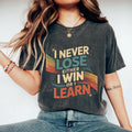 I Never Lose Either I Win Or I Learn Motivational Quote Moral Lesson Inspiration Confidence Graphic Tee – Warm & Stylish · Trending Graphic Apparel