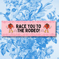 Race You to the Rodeo Boho Bumper Sticker Funny Saying Western Aesthetic Sticker for Car Silly Cowboy or Cowgirl Floral Bumper Sticker Graphic Tee – Premium Graphic · High-Quality Print