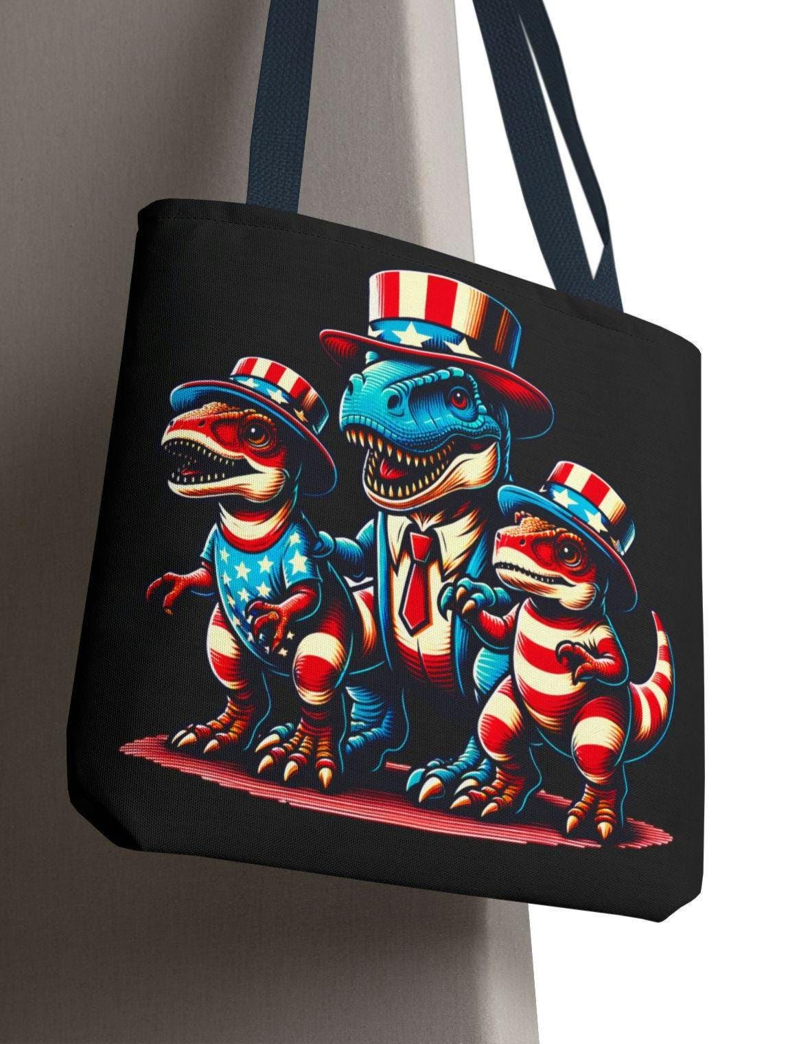 Patriotic Dino Parade Tote Bag Fun Dinosaur Design Eco Friendly Shopping Bag Gift for Dino Lovers Perfect for Summer Adventures Tote Bag – Bold Style · Great Gift For Fans