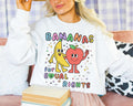 Colorful Equal Rights Sweatshirt with Funny Saying Bananas for Equal Rights Cute Fruit Lover Crewneck for Pride Month Proud LGBTQ Ally Sweatshirt – Feel-Good Design · Trending Graphic Apparel