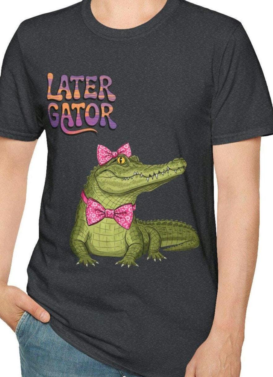 Later Gator Pink Bow Tie Unisex Softstyle T Shirt Later Gator Shirt Animal Lover Tee Funny Graphic Tee Cute Reptile Coquette Flower Graphic Tee – Aesthetic Look · Must-Have Style